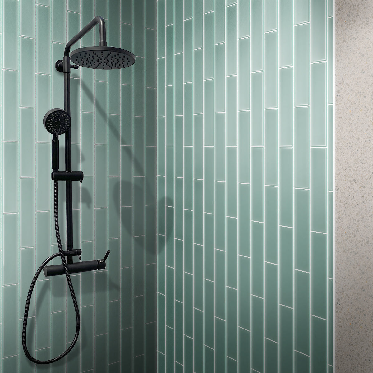 Blizzard blue matte glass subway tile 3x12 inch installed on shower wall