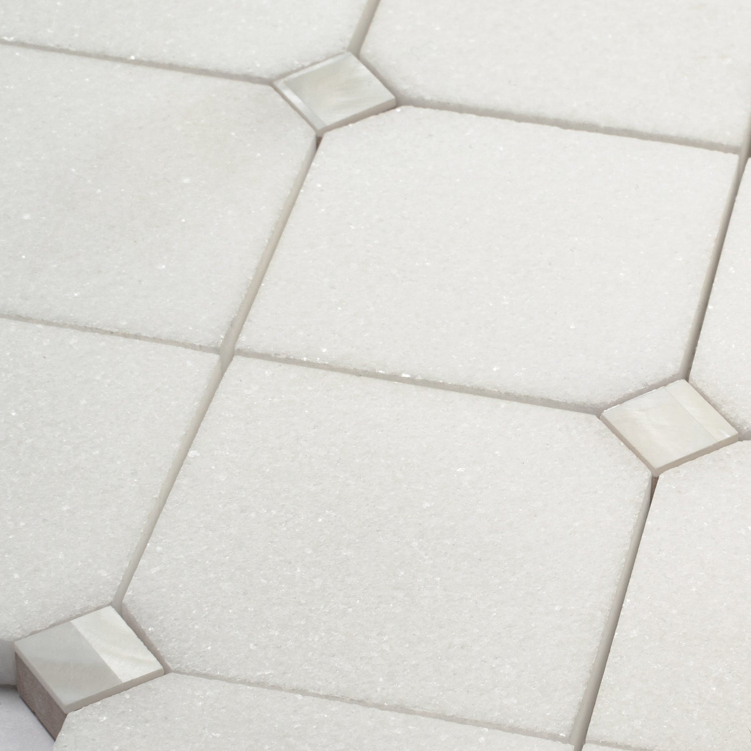 Pearl white polished Thassos hexagon mosaic tile with shell accents in 11x11 size