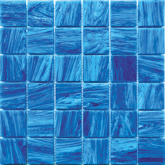 Glossy ultramarine blue glass mosaic tile sheet with swirling pattern in 12x12 layout