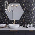 Black and gold honed hexagon PVC peel and stick tile on bathroom wall