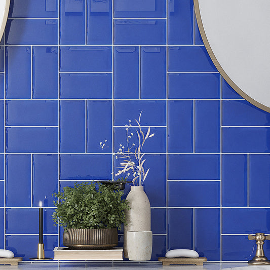 Cobalt blue 3x6 glossy glass subway tile installed as kitchen backsplash wall