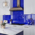 Glossy cobalt blue glass 3x12 subway tile backsplash with herringbone accent in kitchen wall