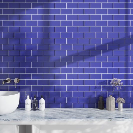 Cobalt blue 3x6 matte glass subway tile backsplash in bathroom setting