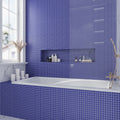 cobalt blue matte glass mosaic square tile 12x12 installed on bathroom wall and bathtub surround