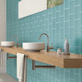Sky blue 3x6 matte glass subway tile backsplash installed on bathroom wall