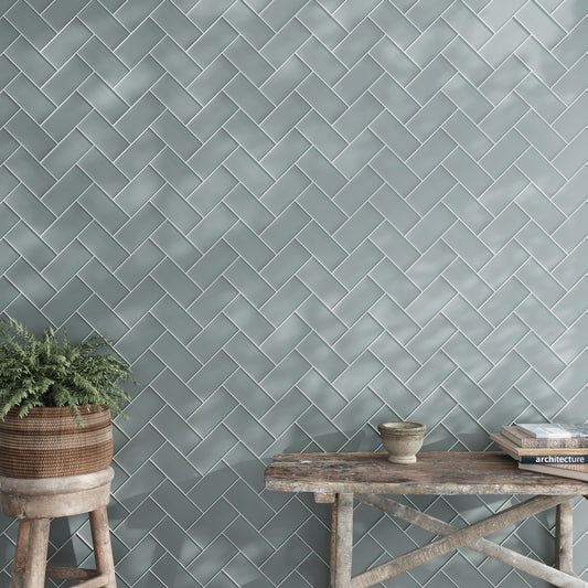 Stone blue matte glass subway tile 3x6 inch herringbone pattern on wall