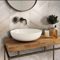 Chiffon white matte porcelain chevron tile in 18x36 large format on bathroom wall