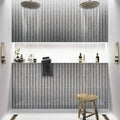 12x12 silver glass herringbone mosaic tile with glossy finish on the shower wall