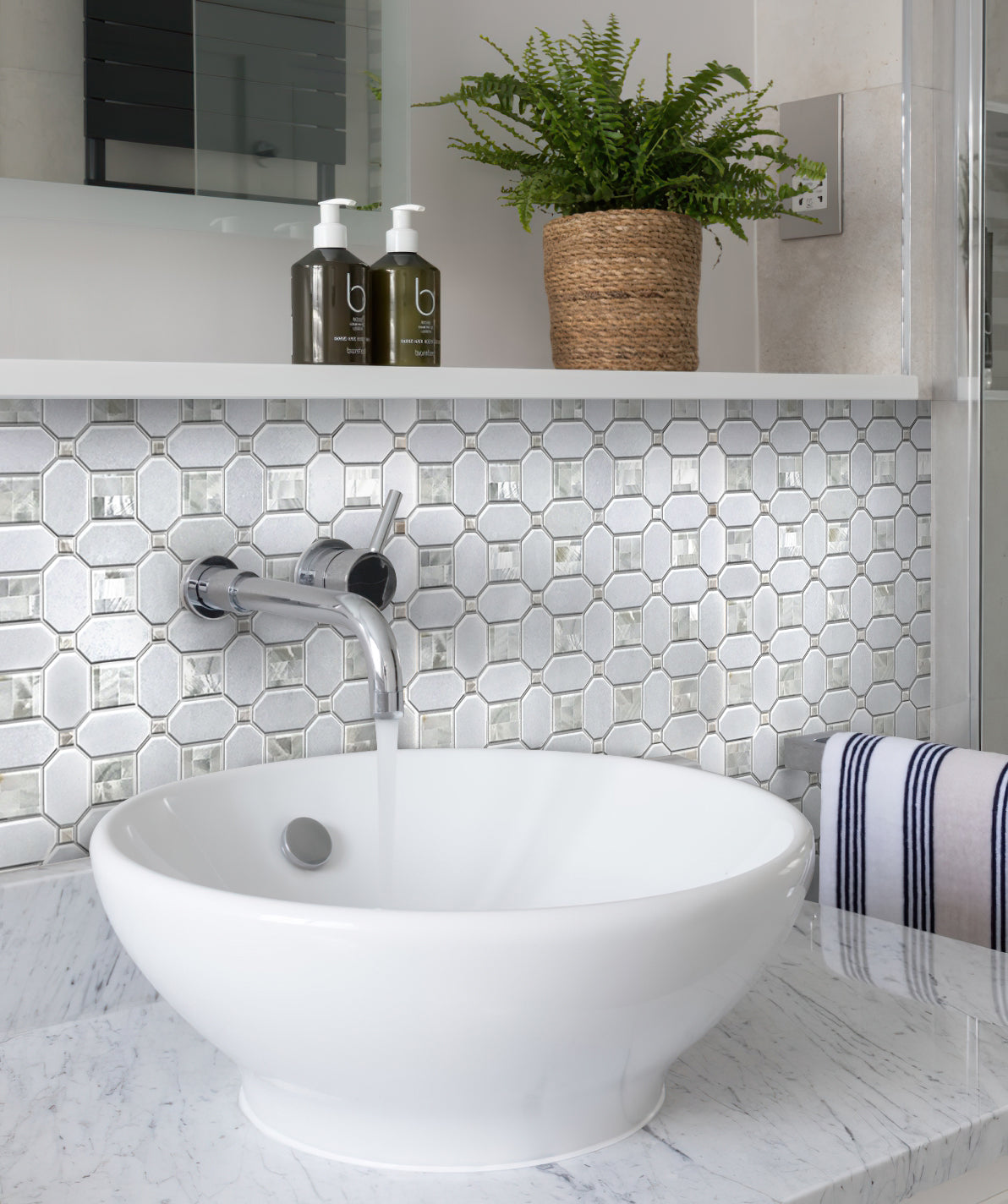 Pearl White polished Thassos shell octagon mosaic tile backsplash in bathroom setting