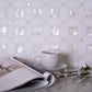 Pearl White polished Thassos shell octagon mosaic tile with square insets arranged in pattern