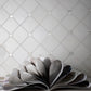 Pearl white polished Thassos shell hexagon mosaic tile with subtle shine and textured grout lines