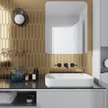 Glossy gold ceramic 2x10 picket tiles on bathroom wall