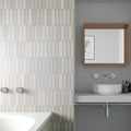 Cotton white 2x10 matte ceramic picket tiles installed on bathroom wall