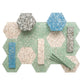 Glossy mint green terrazzo hexagon tiles with copper flecks and blue and beige accents