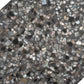 Glossy black terrazzo hexagon tile with amber pearl shell flecks 9x8 inches