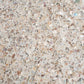 Glossy ivory white terrazzo hexagon tile with copper and shell flecks close-up