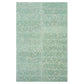 Glossy mint green 3x12 terrazzo subway tile with copper flecks and shell accents