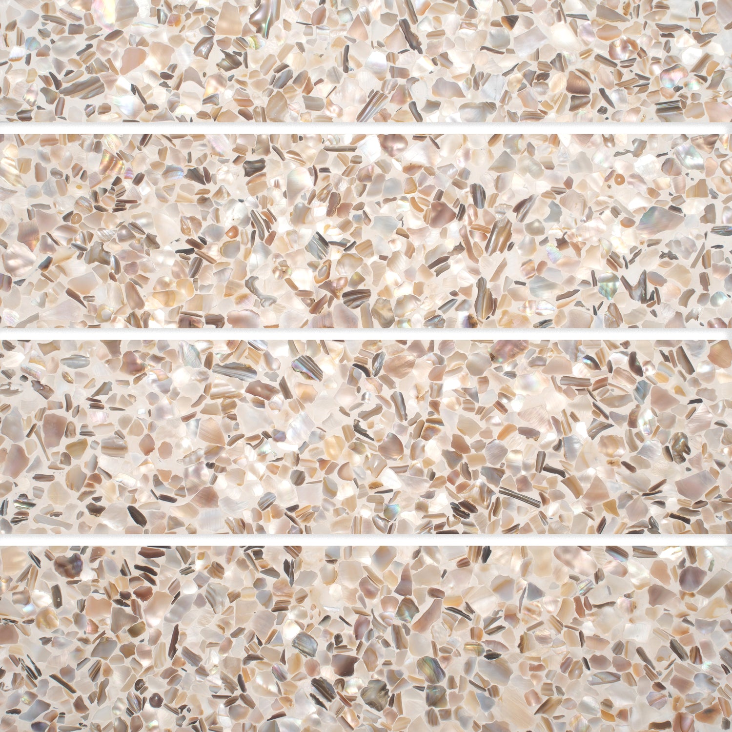 Glossy 3x12 ivory white terrazzo shell tile with copper flecks and elongated subway shape