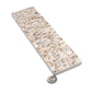 Ivory white terrazzo elongated subway tile with copper flecks and glossy shell finish 3x12