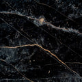 matte midnight gray porcelain tile with burnt amber and rust-colored veins 32x32 large format square