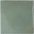 soft sage green glossy porcelain zellige square tile with subtle texture and irregular edges