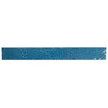 Glossy teal green ceramic zellige subway tile 2x16 inches with textured surface