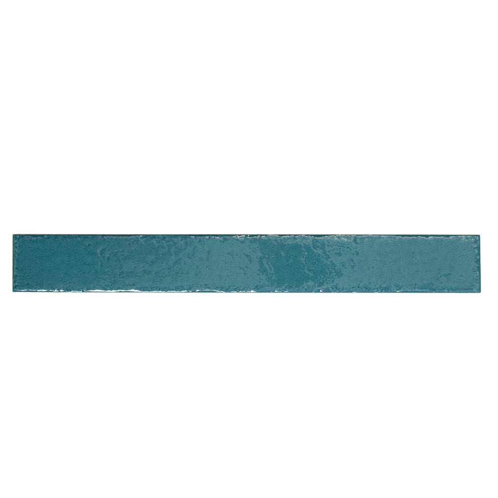Tropical teal glossy Zellige ceramic tile bathtub surround in a vertical subway pattern