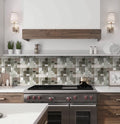 Light gray multi-shaped glass stone mosaic tile with polished, matte, and textured finishes on kitchen backsplash