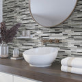 Gray glass and stone linear mosaic tile with glossy and matte finish on bathroom backsplash