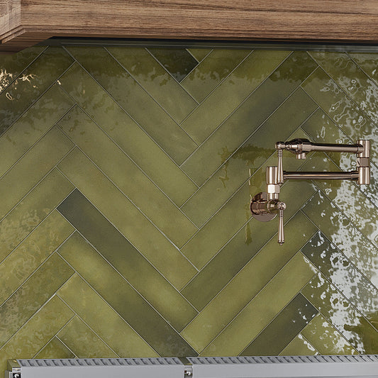 Glossy olive green ceramic subway tile, 2.56x15.75 inches, arranged on kitchen backsplash wall