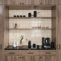 Beige 4x4 glossy square ceramic tile backsplash on kitchen wall