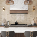 Beige glossy ceramic subway tile 2.6x16 inches installed on kitchen wall