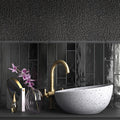 black glossy ceramic pencil tile trim with varied rectangular shapes on a kitchen or bathroom backsplash