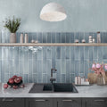Blue gray glossy ceramic pencil tile trim 0.5x8 inches on kitchen backsplash