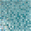 Glossy mint green 12x12 glass mosaic tiles with iridescent finish in uniform square pattern