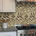 Beige polished foiled glass resin stone mosaic square tiles on the kitchen backsplash