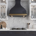 White 12x12 honed Bianco Carrara marble tile backsplash with light gray veining in kitchen wall