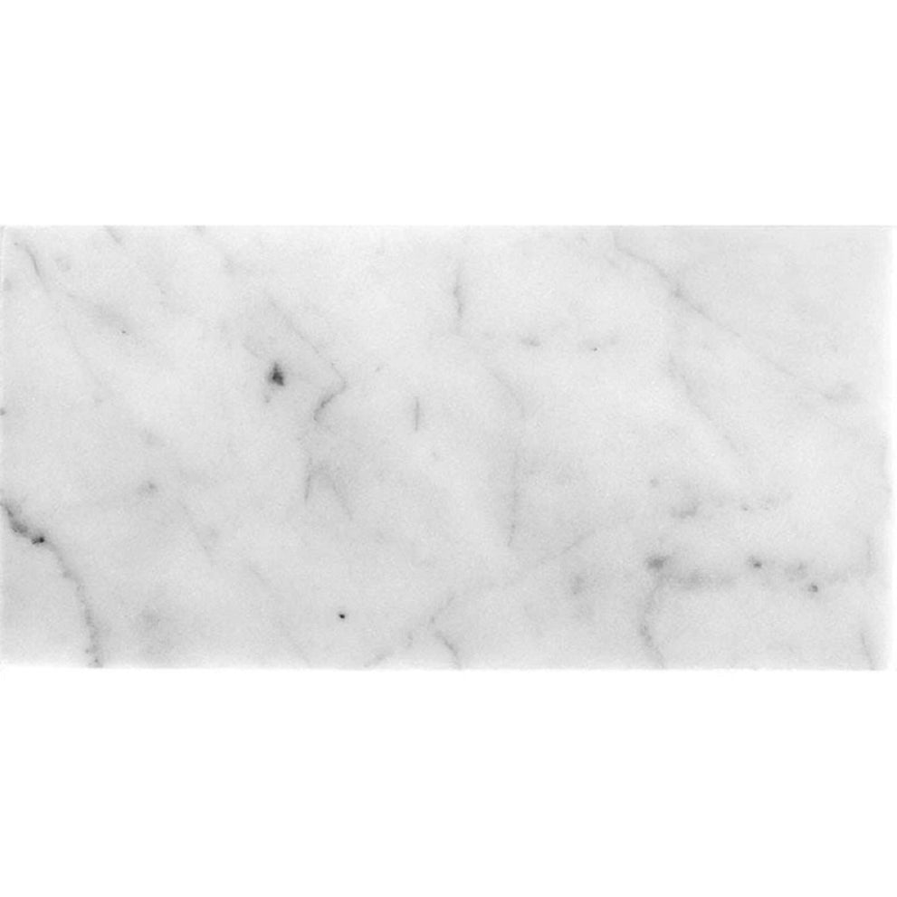 Staggered 12x24 tile patterns in white honed field Bianco Carrara marble tile