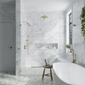 White honed Bianco Carrara marble 12x24 wall tile in bathroom shower and surrounding walls