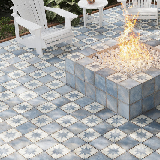 weathered slate 8x8 matte blue grey porcelain tile with subtle star pattern on outdoor fire pit surround