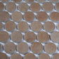 Taupe matte recycled glass round mosaic tiles arranged on white mesh backing