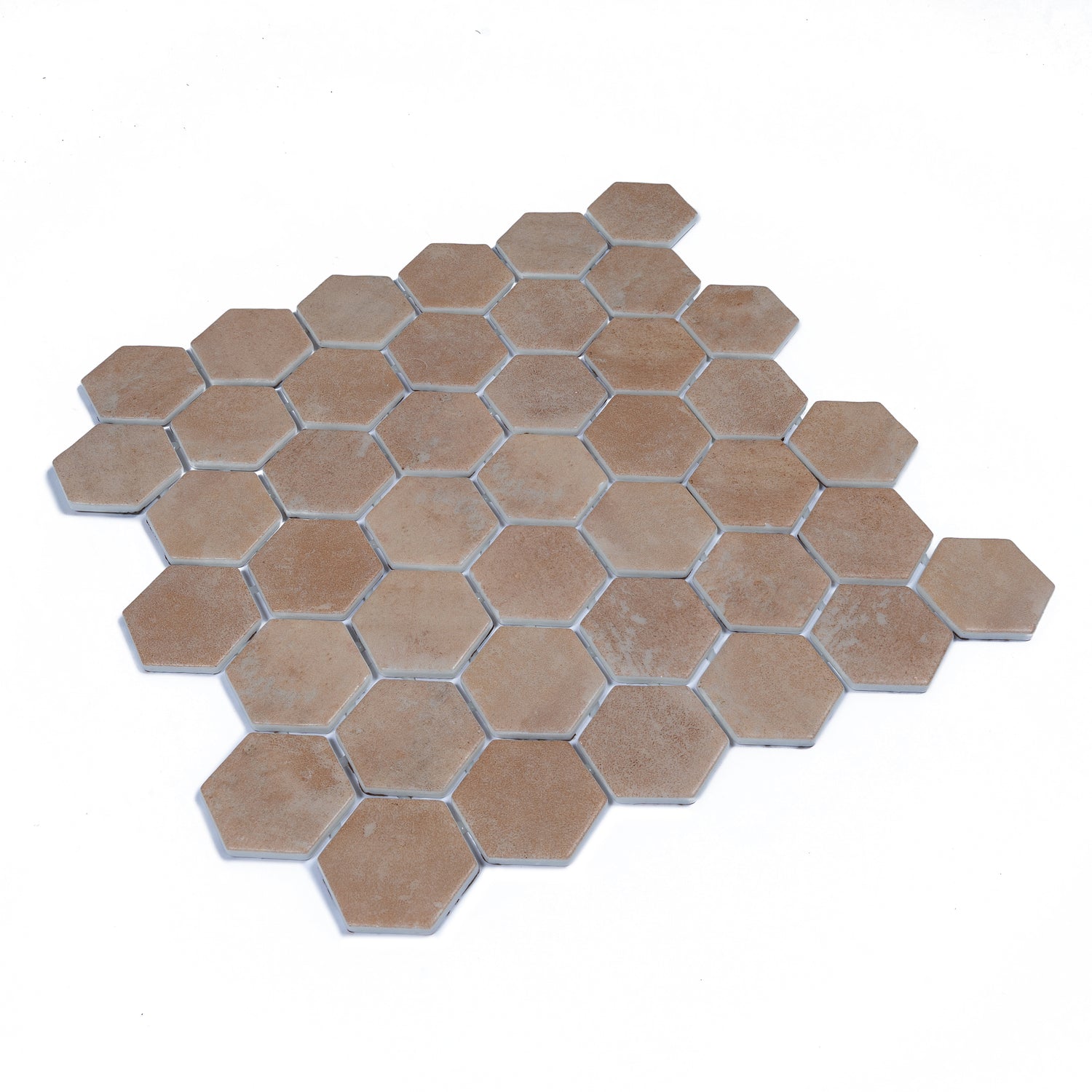 clay beige matte recycled glass hexagon mosaic tile arranged on white background