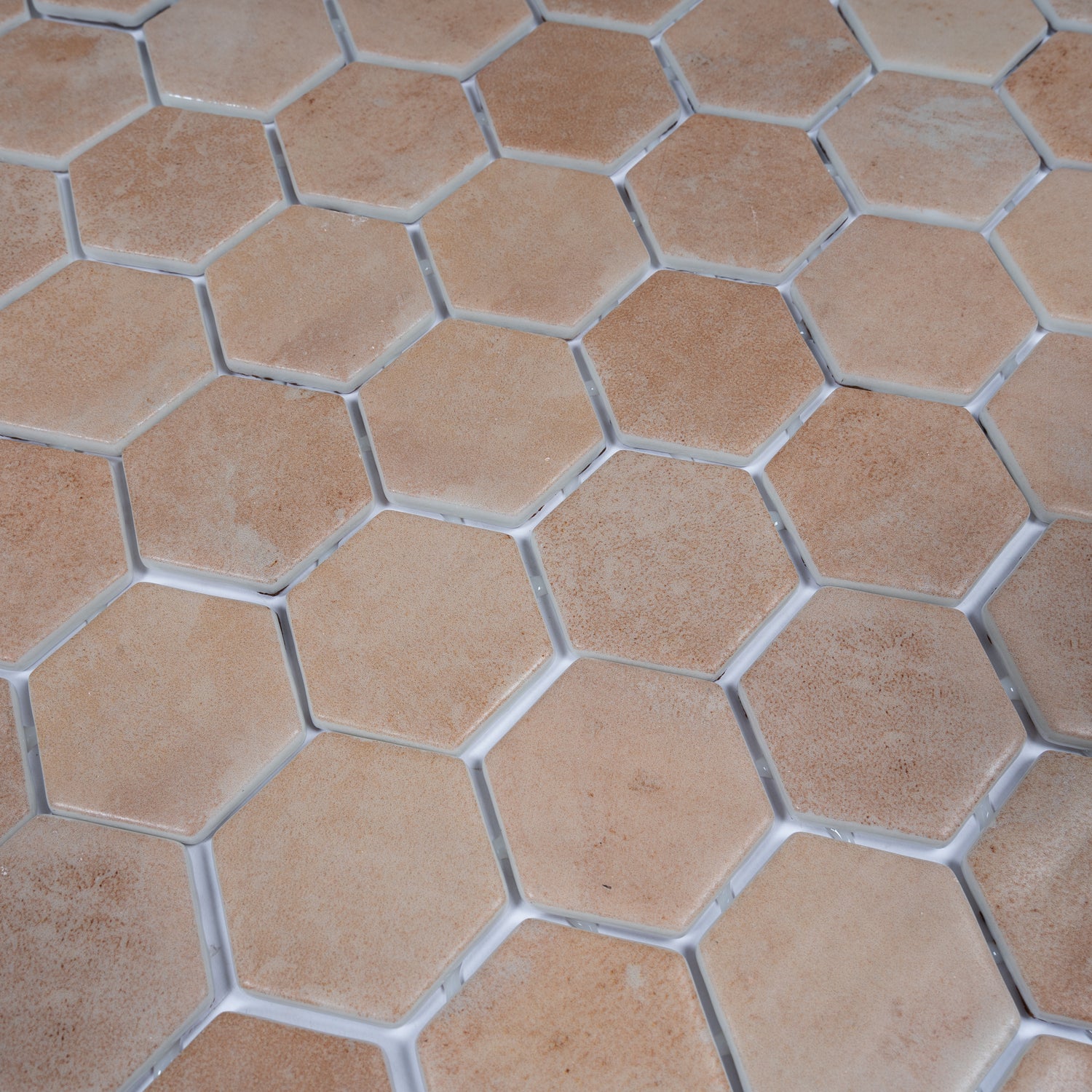 Clay beige matte recycled glass hexagon mosaic tile with 12x12 inch dimensions and grout lines