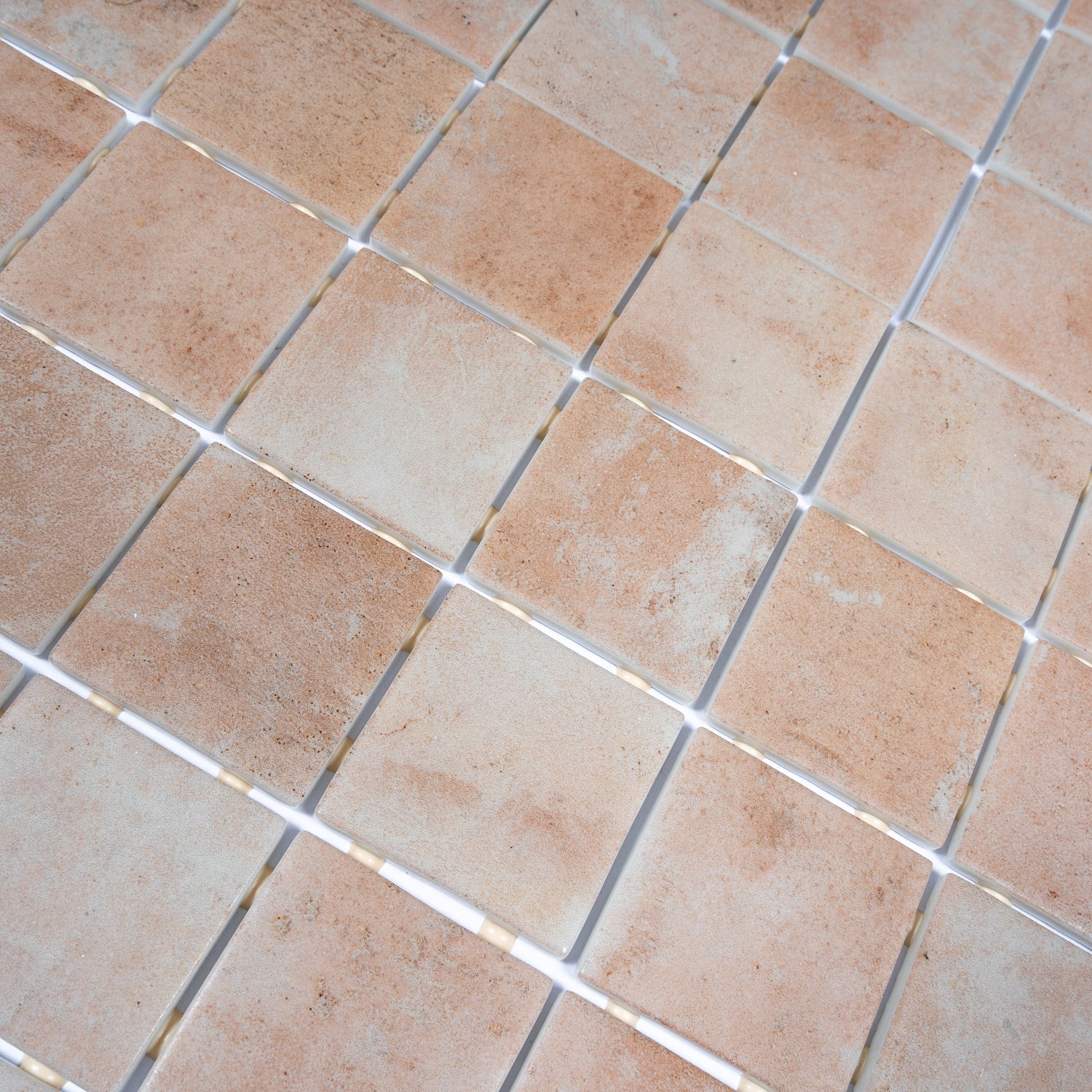 matte clay beige 12x12 recycled glass square mosaic tile arranged in grid pattern