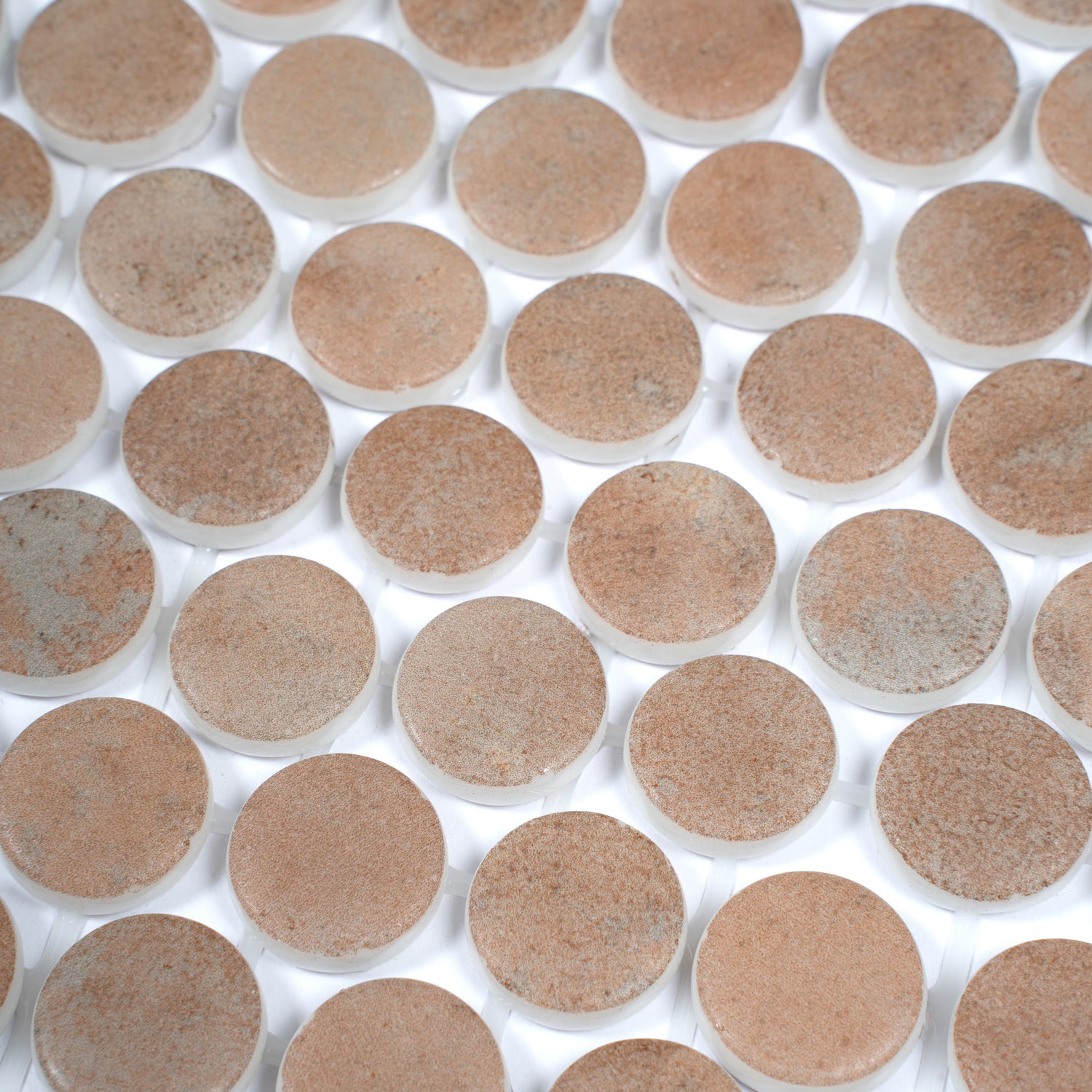 clay beige matte recycled glass round mosaic tiles on white mesh backing for easy installation