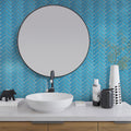 Glossy sapphire blue glass herringbone mosaic tile on bathroom wall