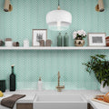 Blizzard blue glossy glass herringbone mosaic tile on kitchen backsplash wall