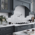 White glossy glass herringbone mosaic tile backsplash in kitchen with polished finish, 11x12.6 inches