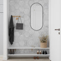 Soft white matte porcelain hexagon tile with subtle texture on wall surface
