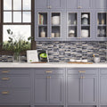 Blue gray polished and textured glass and stone trapezium mosaic tile backsplash on a kitchen